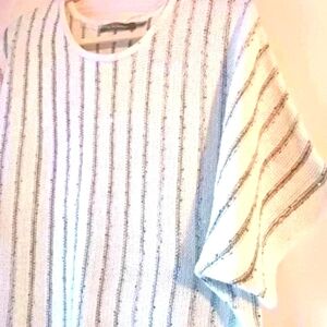 Beautiful soft white Boho sweater with fringe. Sequin detail Dolman sleeves. M